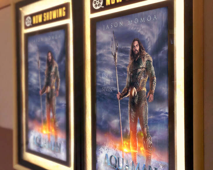 Aquaman movie poster featuring Jason Momoa, highlighting the character's iconic look and tagline 'Unite the Seven'.