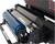 Close-up of a printing machine with visible brand name on a white background